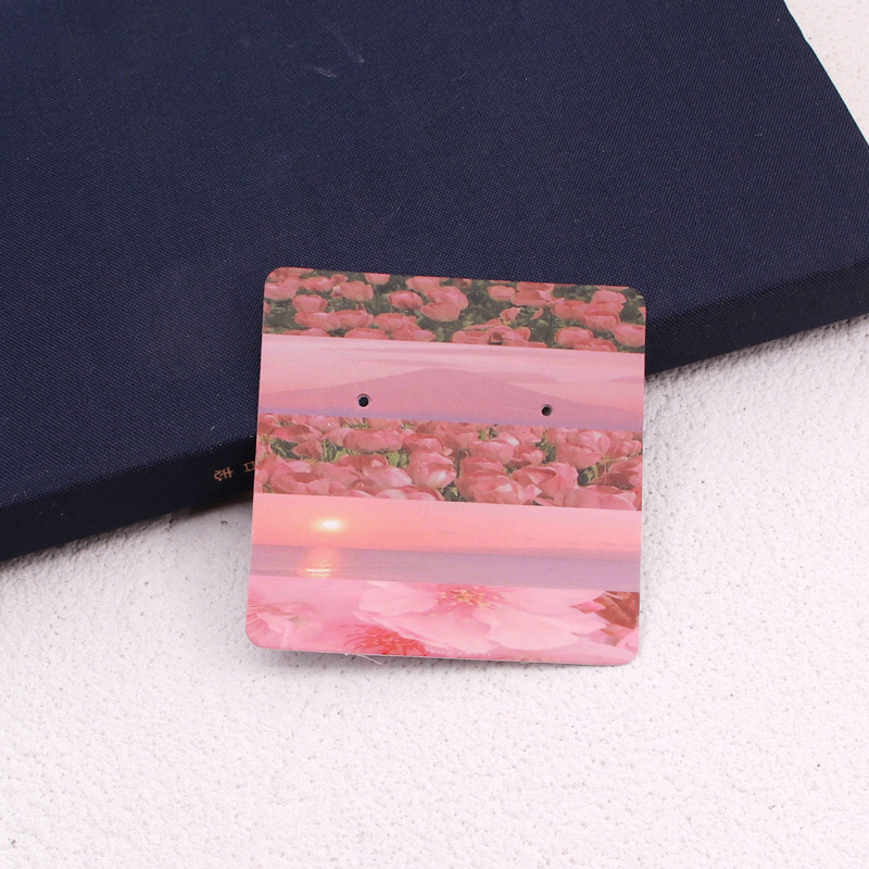 Komi auskarų ekspozicinė kortelė su 400 g vario plokštele, spalvotas spausdinimas, juvelyriniai dirbiniai