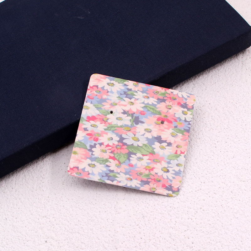 Komi auskarų ekspozicinė kortelė su 400 g vario plokštele, spalvotas spausdinimas, juvelyriniai dirbiniai