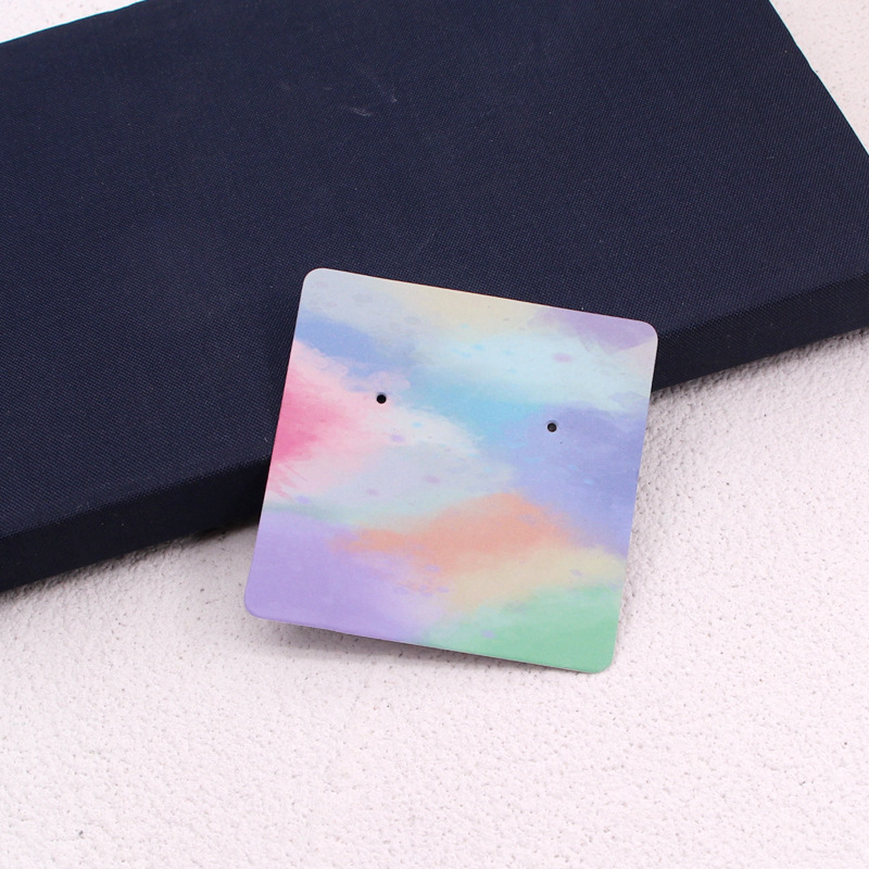 Komi auskarų ekspozicinė kortelė su 400 g vario plokštele, spalvotas spausdinimas, juvelyriniai dirbiniai