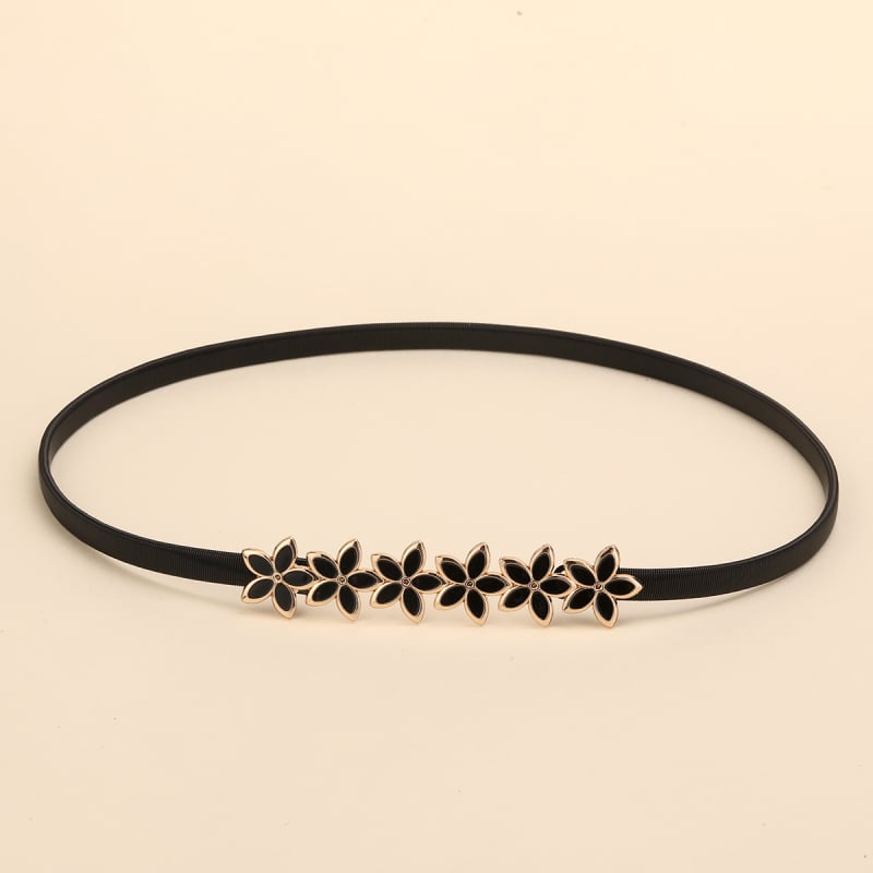 Virágmintás deréköv, vékony szélességű (<2 cm), fém anyagú, tűcsatos csattal, elektroplattált felülettel