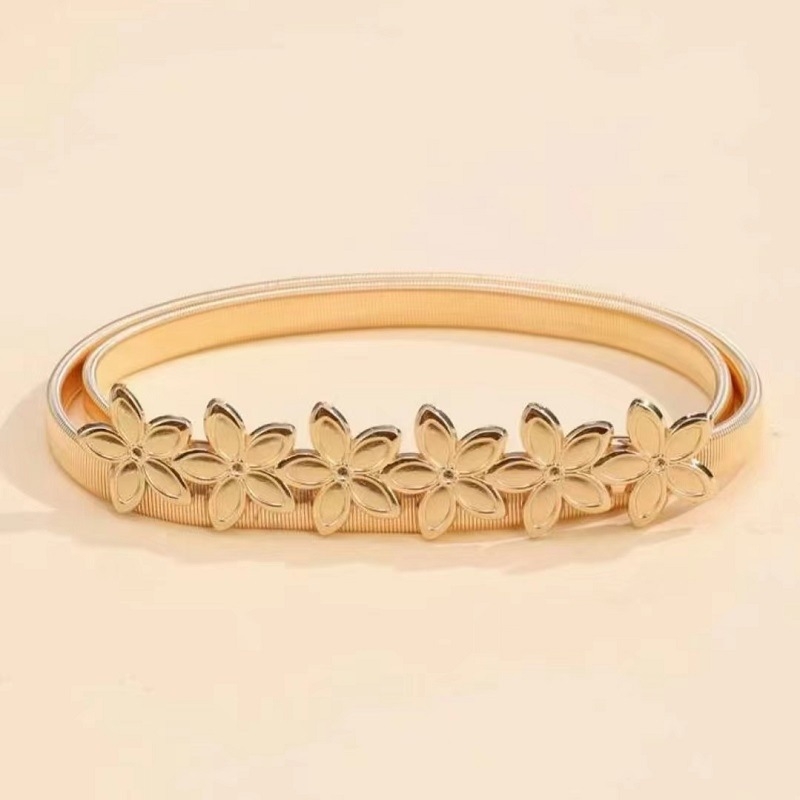 Virágmintás deréköv, vékony szélességű (<2 cm), fém anyagú, tűcsatos csattal, elektroplattált felülettel