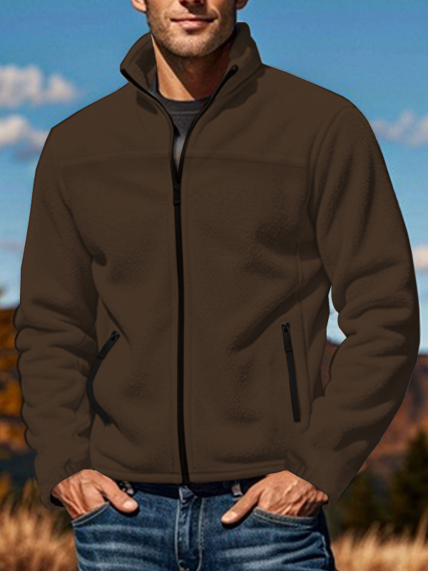 Polārfleksa jaka ar stāvošu apkakli, pielāgots siluets, rāvējslēdzēja aizdare, bieza polārfleks, vairākas kabatas.