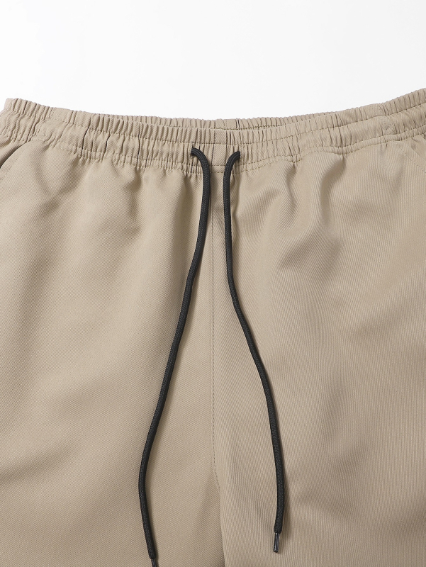 Kasdieninės darbo kelnės, laisvas kirpimas, devynių taškų ilgis, vidurio juosta, raištelių užsegimas