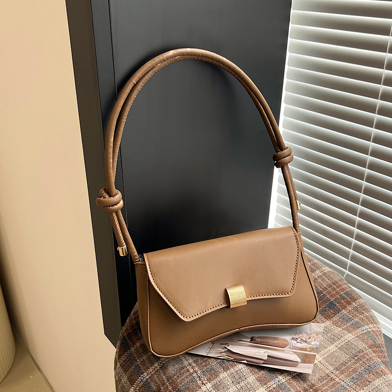 Pilsētas minimālisma stilā pleca soma, PU āda, horizontāla kvadrāta forma, aizvērums ar slēdzi, iekšējā kabata ar rāvējslēdzēju, apdare no sintētiskās ādas, viena plecu siksna, ikdienas lietošanai