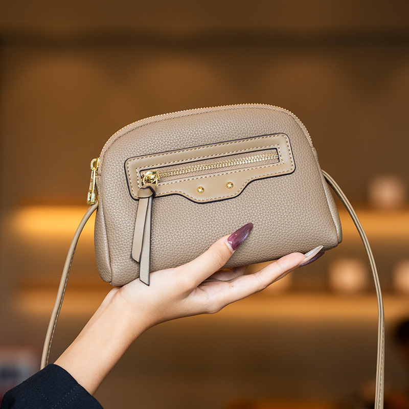 GELANDAI Crossbody soma – minimālistisks dizains, mazs kvadrātveida formāts, PU materiāls, rāvējslēdzējs aizvēršanai, iekšējie nodalījumi: tālruņa kabata, slēgta rāvējslēdzēja kabata, nodalījums, klēpjdatora kabata