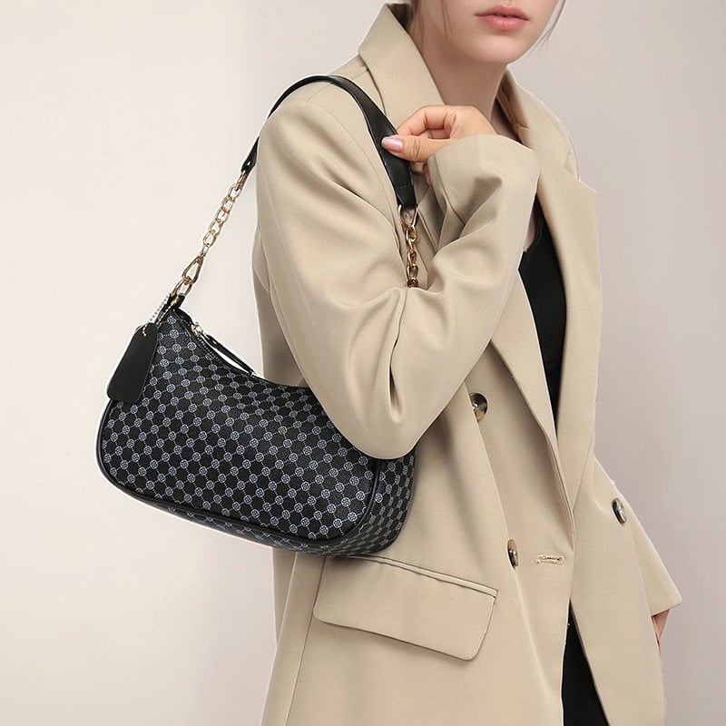 Eleganti PU crossbody krepšys su retro spauda, kompakti stačiakampis formos; turi telefonų kišenę ir dokumentų kišenę; užsegama užtrauktuku; dvigubos peties juostos; tinkama kasdieniam dėvėjimui.