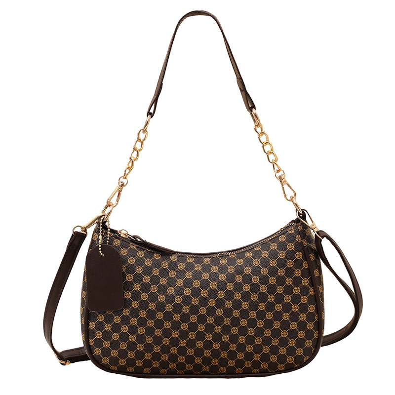 Eleganti PU crossbody krepšys su retro spauda, kompakti stačiakampis formos; turi telefonų kišenę ir dokumentų kišenę; užsegama užtrauktuku; dvigubos peties juostos; tinkama kasdieniam dėvėjimui.