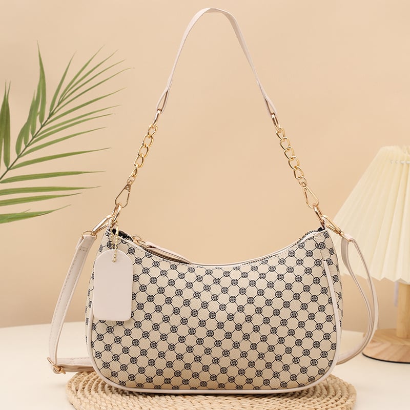 Eleganti PU crossbody krepšys su retro spauda, kompakti stačiakampis formos; turi telefonų kišenę ir dokumentų kišenę; užsegama užtrauktuku; dvigubos peties juostos; tinkama kasdieniam dėvėjimui.