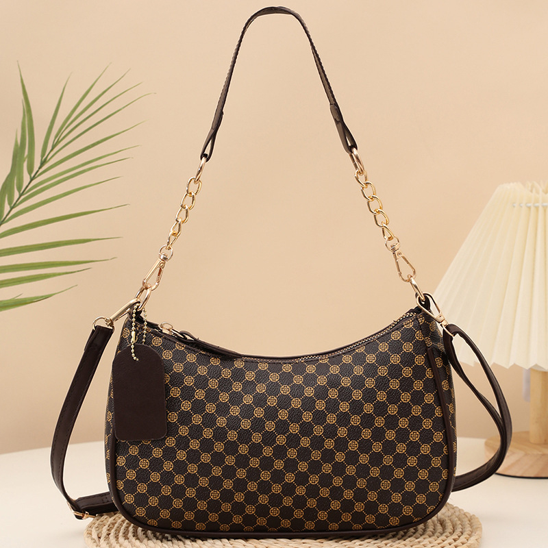 Eleganti PU crossbody krepšys su retro spauda, kompakti stačiakampis formos; turi telefonų kišenę ir dokumentų kišenę; užsegama užtrauktuku; dvigubos peties juostos; tinkama kasdieniam dėvėjimui.