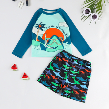 Παιδικό σετ μαγιό δύο τεμαχίων με μακριά μανίκια, εκτύπωση καρχαρία, στρογγυλός λαιμός, ελαφρύ ύφασμα πολυεστέρα 100%.