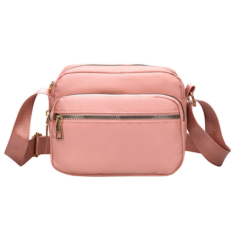 Női kompakt, négyzet alakú táska mindennapi használatra — városi egyszerű stílus, anyaga Oxford vászon, vízszintes négyzet alak, cipzáras nyitás, belső cipzáras zseb.