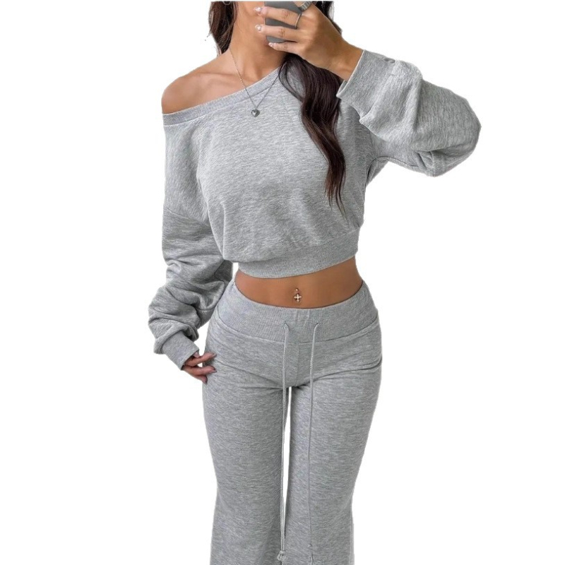 Moterų dviejų dalių rinkinys: pečių neapsižengiantis viršus su ilgomis rankovėmis ir klostuotos kelnės, vienos spalvos, iš poliesterio su medvilne ir elastanu 70–80%/30%, rudens-žiemos 2025.