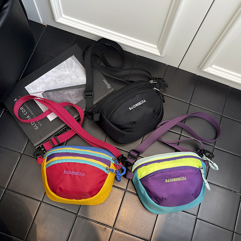 Unisex mini crossbody krepšys, Oxford audinys, vidinė kišenė – nailonas, užtrauktukas, vidiniai kišenės: užtrauktuko kišenė, telefono kišenė, ID kišenė, ovalo formos, laisvalaikio kelionėms