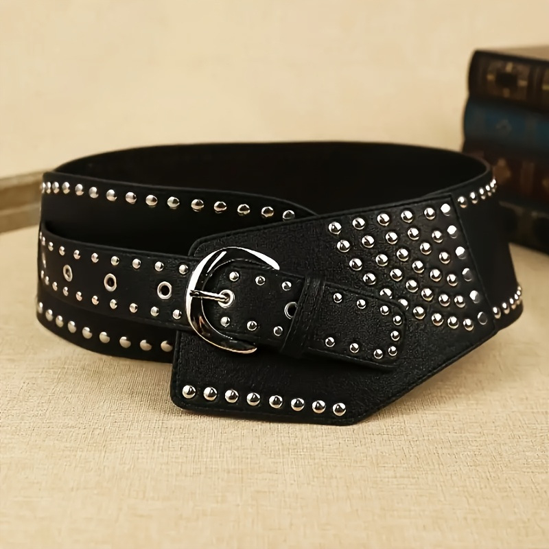 Sieviešu asimetriska plata josta no mākslīgās ādas ar cinka sakausējuma sprādzi; platums >4 cm; aizdare ar sprādzi; apdare: patentētā āda; stils: literāri retro