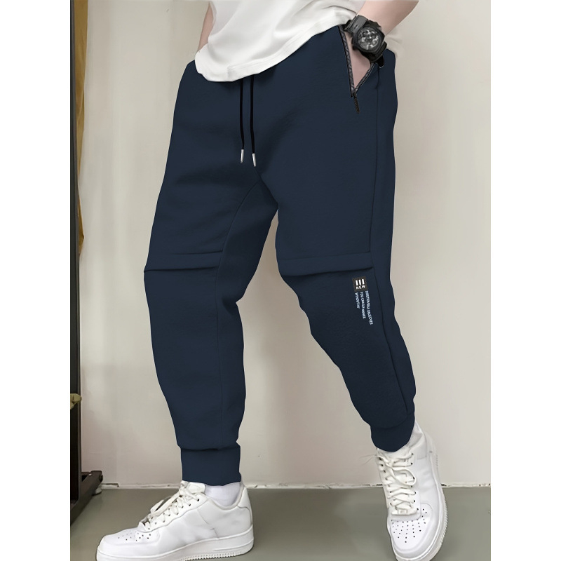 Vīriešu brīvās piegriezuma sporta bikses ar flīsa odai, 100% poliesters, josta ar auklu, garas