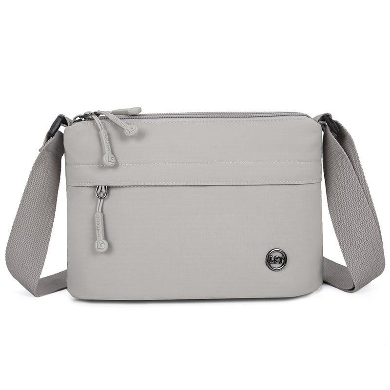 Nailona crossbody soma, pilsētas minimālisma stils, mazs kvadrāta formāts, rāvējslēdzēja atvērums, poliesteru odere, iekšējie kabati ar rāvējslēdzēju