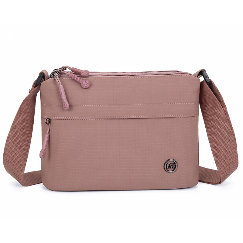 Nailona crossbody soma, pilsētas minimālisma stils, mazs kvadrāta formāts, rāvējslēdzēja atvērums, poliesteru odere, iekšējie kabati ar rāvējslēdzēju