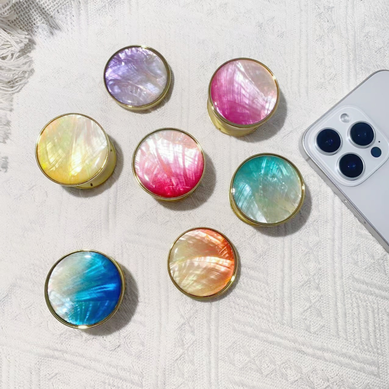 Stāvvai telefona turētājs ar čaulām motīvu no sveķiem, gaisa spilvens, elektroplatinga pārklājums, universāls stils, logotipa pielāgošana — Viqing basket