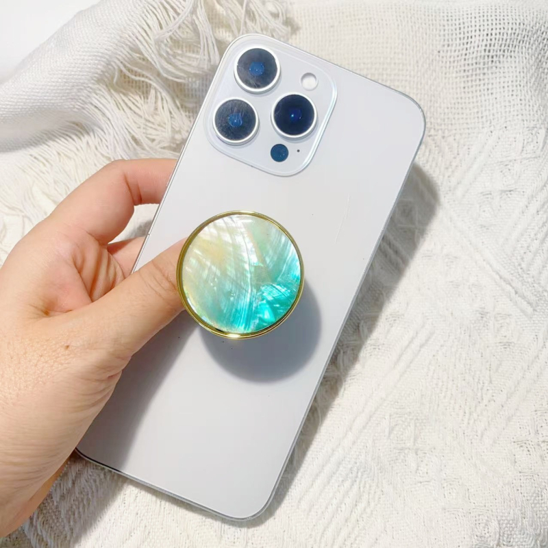 Stāvvai telefona turētājs ar čaulām motīvu no sveķiem, gaisa spilvens, elektroplatinga pārklājums, universāls stils, logotipa pielāgošana — Viqing basket