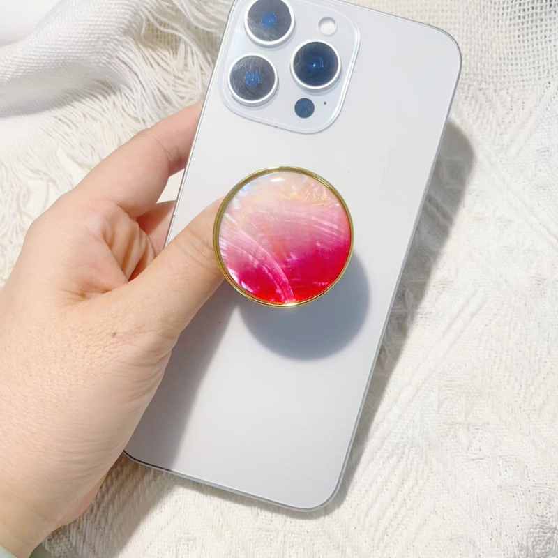 Stāvvai telefona turētājs ar čaulām motīvu no sveķiem, gaisa spilvens, elektroplatinga pārklājums, universāls stils, logotipa pielāgošana — Viqing basket