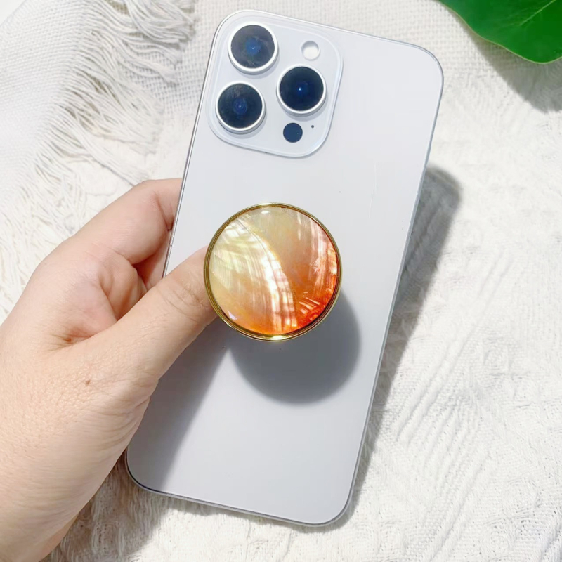 Stāvvai telefona turētājs ar čaulām motīvu no sveķiem, gaisa spilvens, elektroplatinga pārklājums, universāls stils, logotipa pielāgošana — Viqing basket