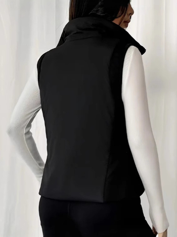 Ženski bezruk vest s uspravnim ovratnikom, prednji zatvarač, uži u struku, normalne duljine