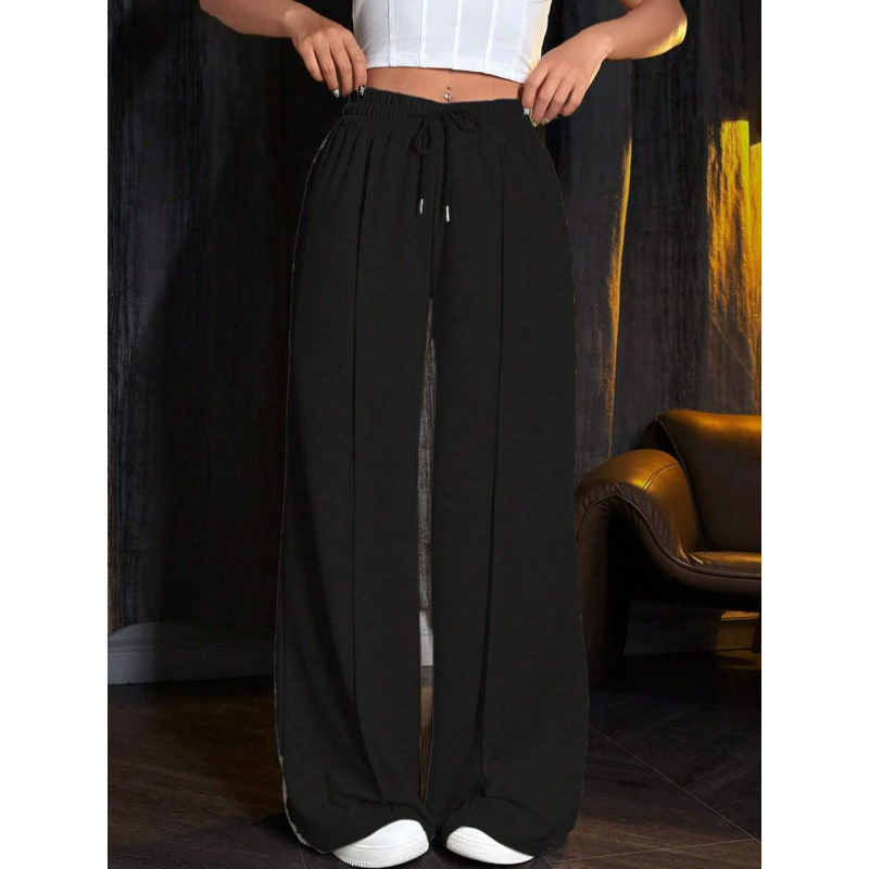Sporta bikses ar brīvu piegriezumu un šņori jostā, acetāta šķiedru maisījums, trīs rindu pogas, 2023. gada vasara