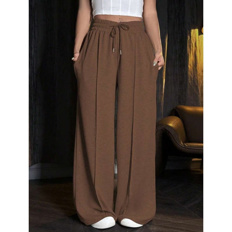 Sporta bikses ar brīvu piegriezumu un šņori jostā, acetāta šķiedru maisījums, trīs rindu pogas, 2023. gada vasara