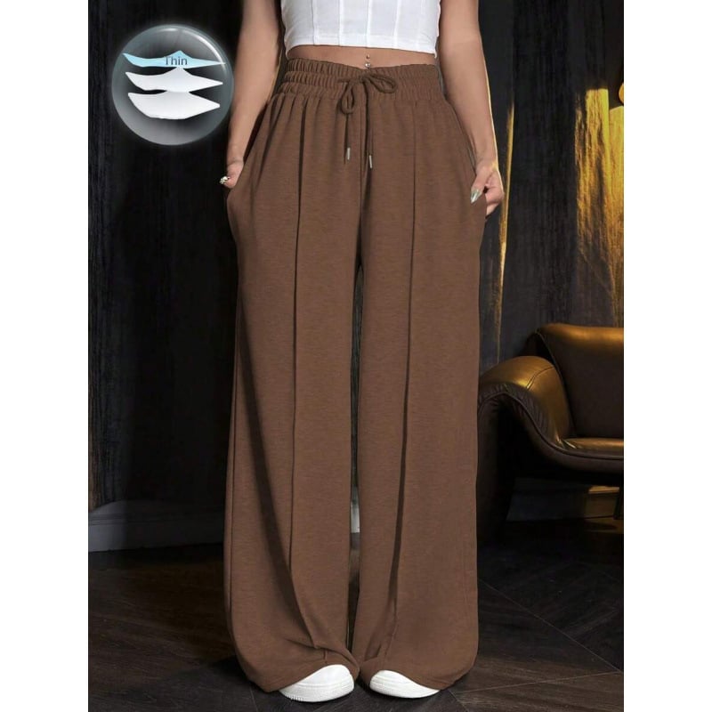 Sporta bikses ar brīvu piegriezumu un šņori jostā, acetāta šķiedru maisījums, trīs rindu pogas, 2023. gada vasara