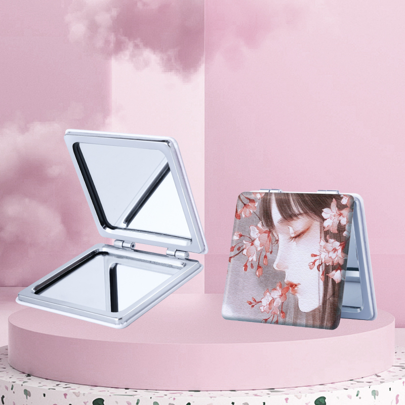 Portatīvs saliekams skaistumkopšanas spogulis ar karikatūras dizainu, zīmols NND; rāmis materiāls: PU/PS/PVC; lēcas materiāls: cits; pilnais materiāls: PU āda + nerūsējošs tērauds + PC + stikls