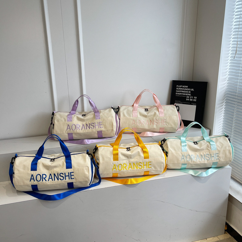 Crossbody soma fitnesam un jogai ar cilindrisku dizainu, 36-55L, neilons, salokāma ar mitrā/sausā atdalīšanu, starptautiskais stils, brīvdienu ceļojumiem