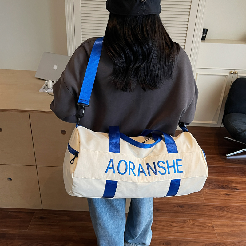 Crossbody soma fitnesam un jogai ar cilindrisku dizainu, 36-55L, neilons, salokāma ar mitrā/sausā atdalīšanu, starptautiskais stils, brīvdienu ceļojumiem