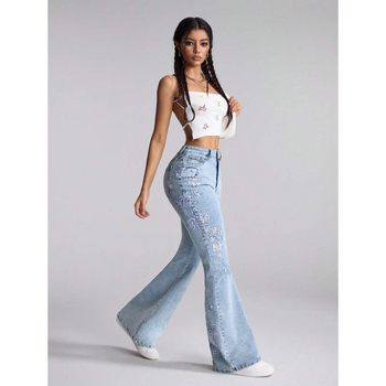 Denim teksapüksid lillemotiiviga, kits lõige, kaldkõrvetega taskud, fleecevooder