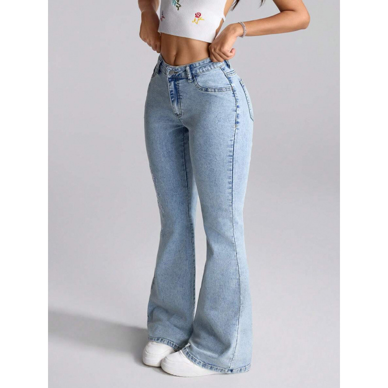 Denim teksapüksid lillemotiiviga, kits lõige, kaldkõrvetega taskud, fleecevooder