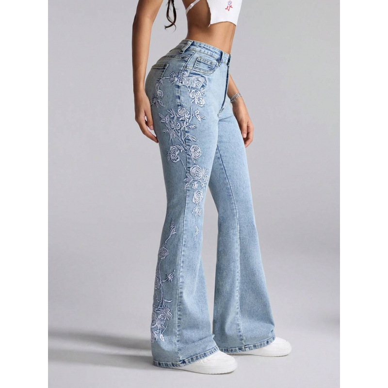 Denim teksapüksid lillemotiiviga, kits lõige, kaldkõrvetega taskud, fleecevooder