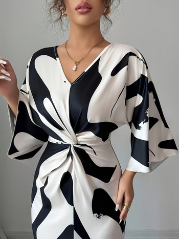 Kleit trikotaažist materjalist, trükiga, V-kaelus, kõrge vöökoht, midi pikkus, 3/4 varrukad