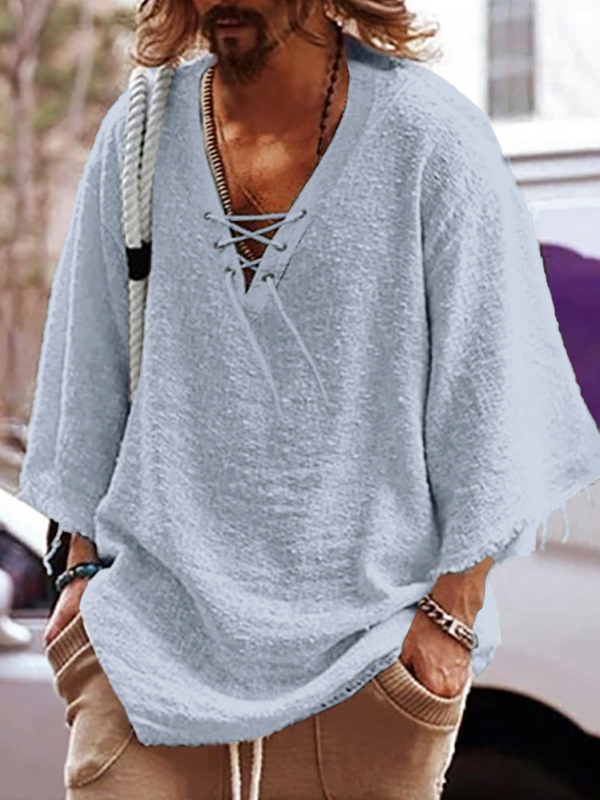 Lõdva lõikega särk poolpikkade varrukatega, V-kaelus nööriga, puuvillast-poliesteri segu