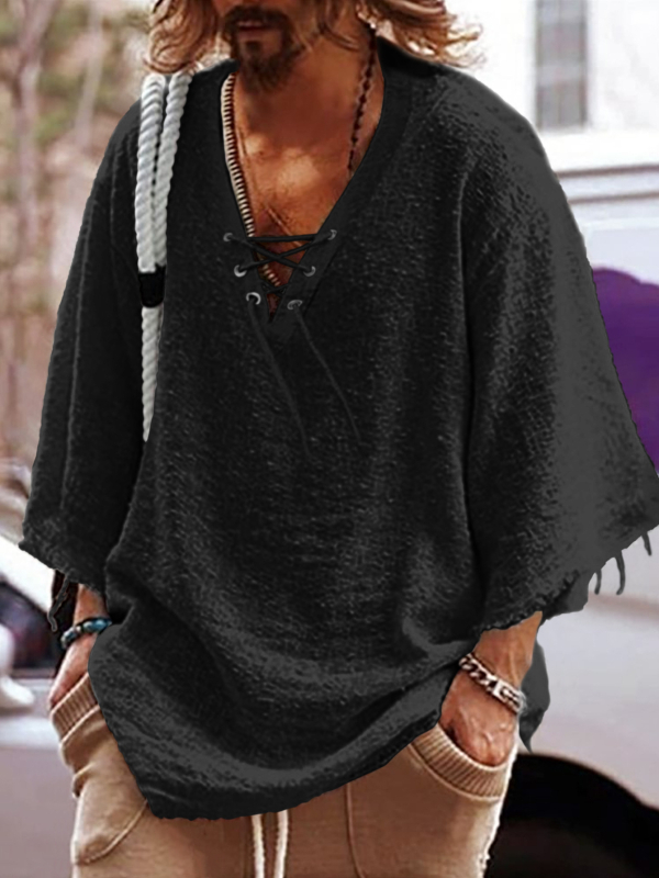 Lõdva lõikega särk poolpikkade varrukatega, V-kaelus nööriga, puuvillast-poliesteri segu