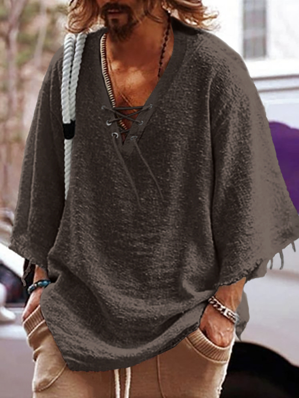 Lõdva lõikega särk poolpikkade varrukatega, V-kaelus nööriga, puuvillast-poliesteri segu