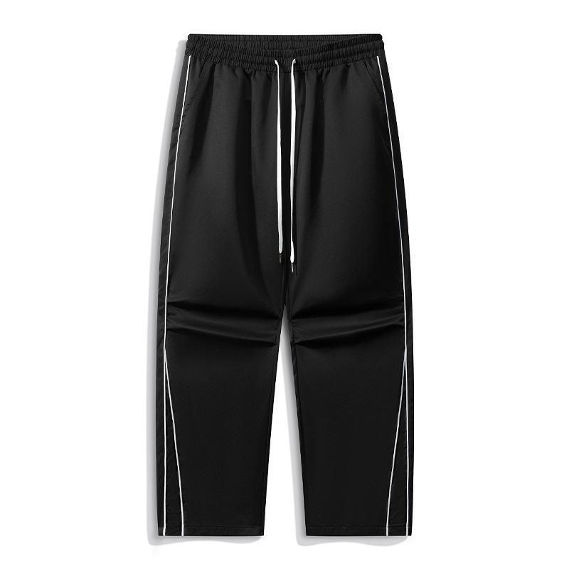 Sportlikud igapäevased püksid patchwork’i ja triipudega, 100% polüester, hingavad ja kortsuvabad, keskjooneline vöökoht, sirge lõige