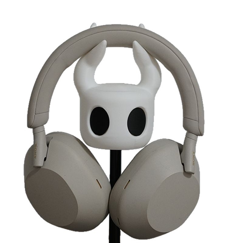 Kõrvaklappide alus lauale – minimalistlik lauaorganisaator (Kõrvaklappide tüüp: Earbud, L-kujuline pistik, kaelal asuvad kõrvaklapid)