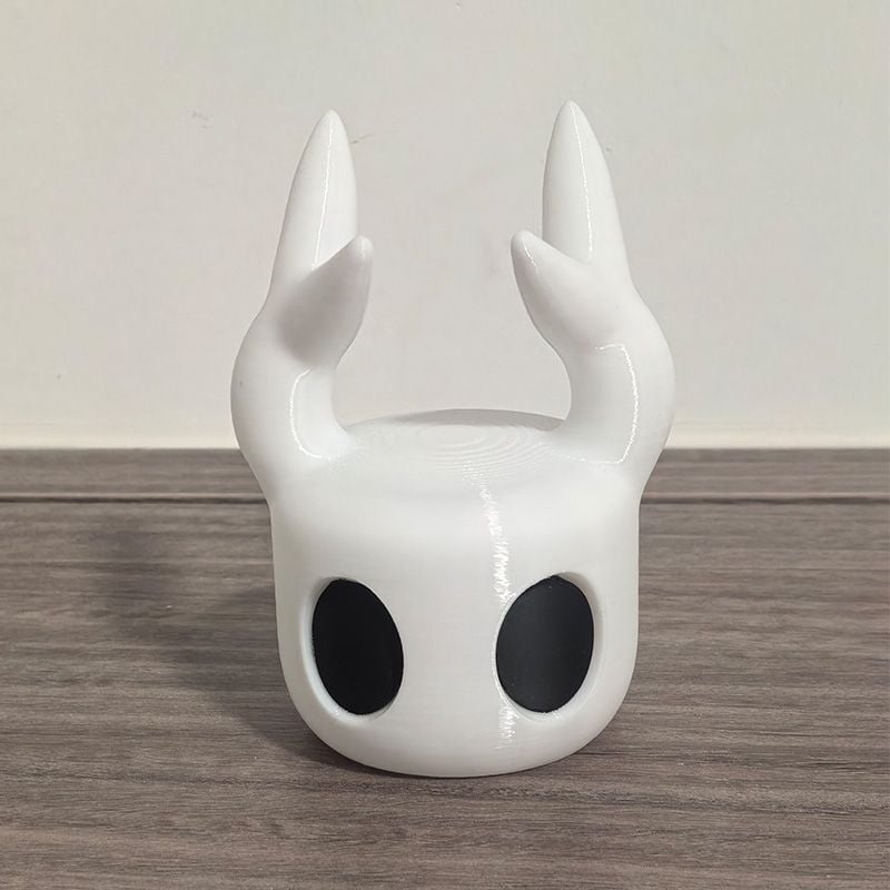 Kõrvaklappide alus lauale – minimalistlik lauaorganisaator (Kõrvaklappide tüüp: Earbud, L-kujuline pistik, kaelal asuvad kõrvaklapid)