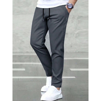 Sportlikud püksid vöökoha taskutega, sirge lõige, vaba istuvus, 9/10 pikkus, looduslikult värvitud puuvill, CVC kangas, kerge venivus, retro stiil