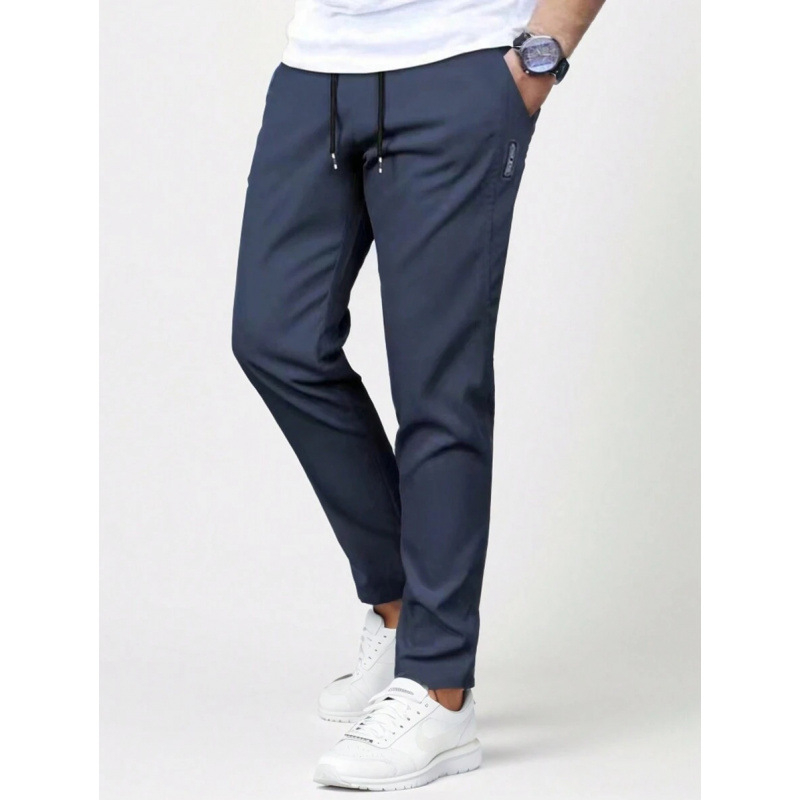 Sportlikud püksid vöökoha taskutega, sirge lõige, vaba istuvus, 9/10 pikkus, looduslikult värvitud puuvill, CVC kangas, kerge venivus, retro stiil