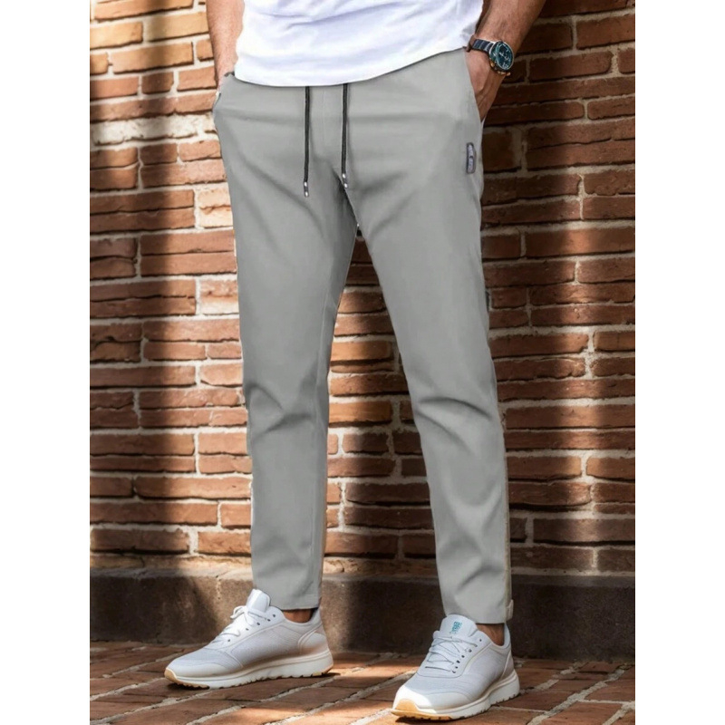 Sportlikud püksid vöökoha taskutega, sirge lõige, vaba istuvus, 9/10 pikkus, looduslikult värvitud puuvill, CVC kangas, kerge venivus, retro stiil