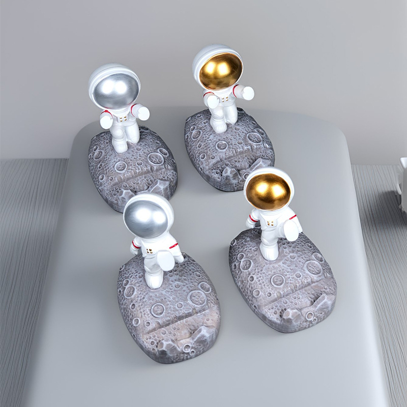 Stalak u obliku astronauta za telefone i tablete – smola, crtani stil, univerzalna kompatibilnost