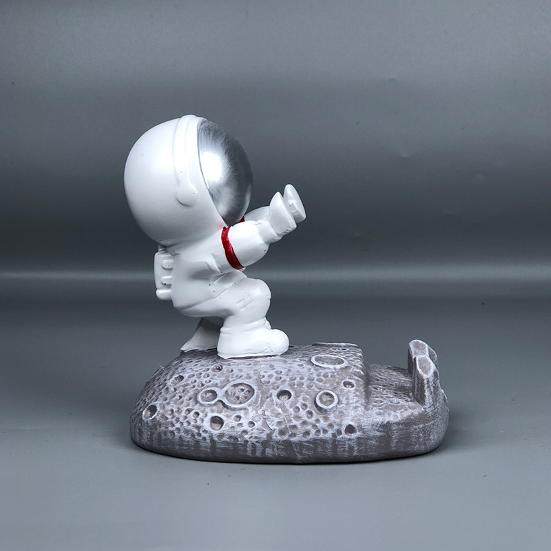 Stalak u obliku astronauta za telefone i tablete – smola, crtani stil, univerzalna kompatibilnost