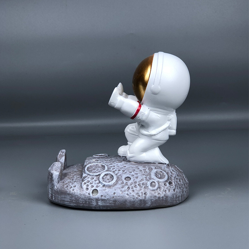 Stalak u obliku astronauta za telefone i tablete – smola, crtani stil, univerzalna kompatibilnost