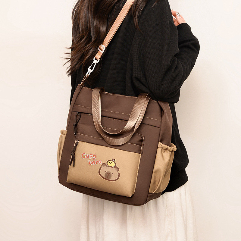 Vaikų kuprinė su animaciniu gyvūnų raštu 1–2 klasei, nailonas, pamušalas poliesteris, išlenktos pečių juostos, atspari dilimui