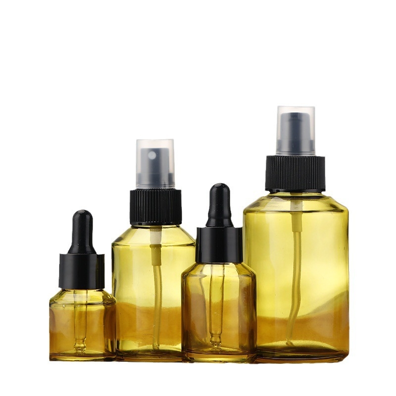 Sklenená fľaša na starostlivosť o pleť s nakloneným ramenom, kvapkadlovým uzáverom a sprejom pre sérumy, oleje a krémy — brúsený povrch, vyfukované sklo, prispôsobiteľné balenie